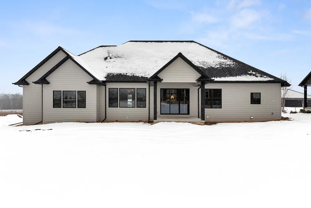 New Construction Classic Ranch Outside Of House With Snow